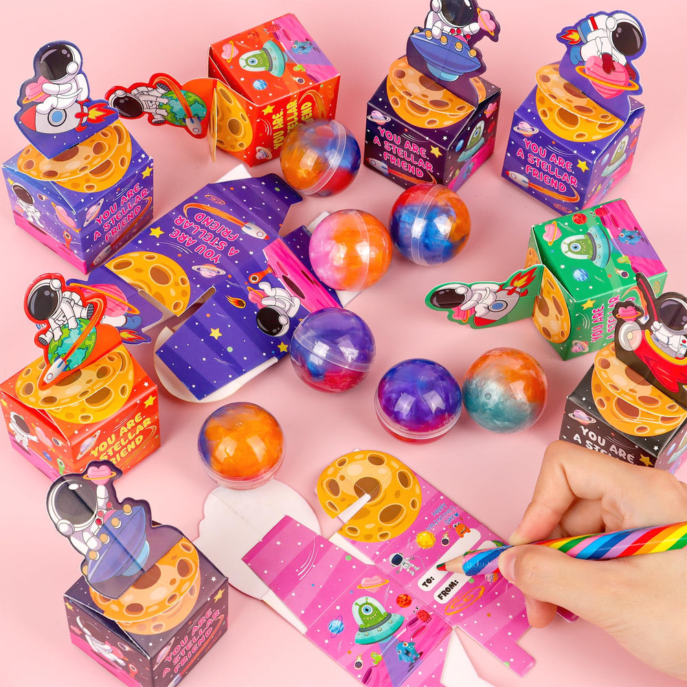 Envotek valentines treat boxes ready to gift with a galaxy slime inside.