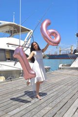 Enyeopd pink number balloons hanging display adds quick party ambiance.