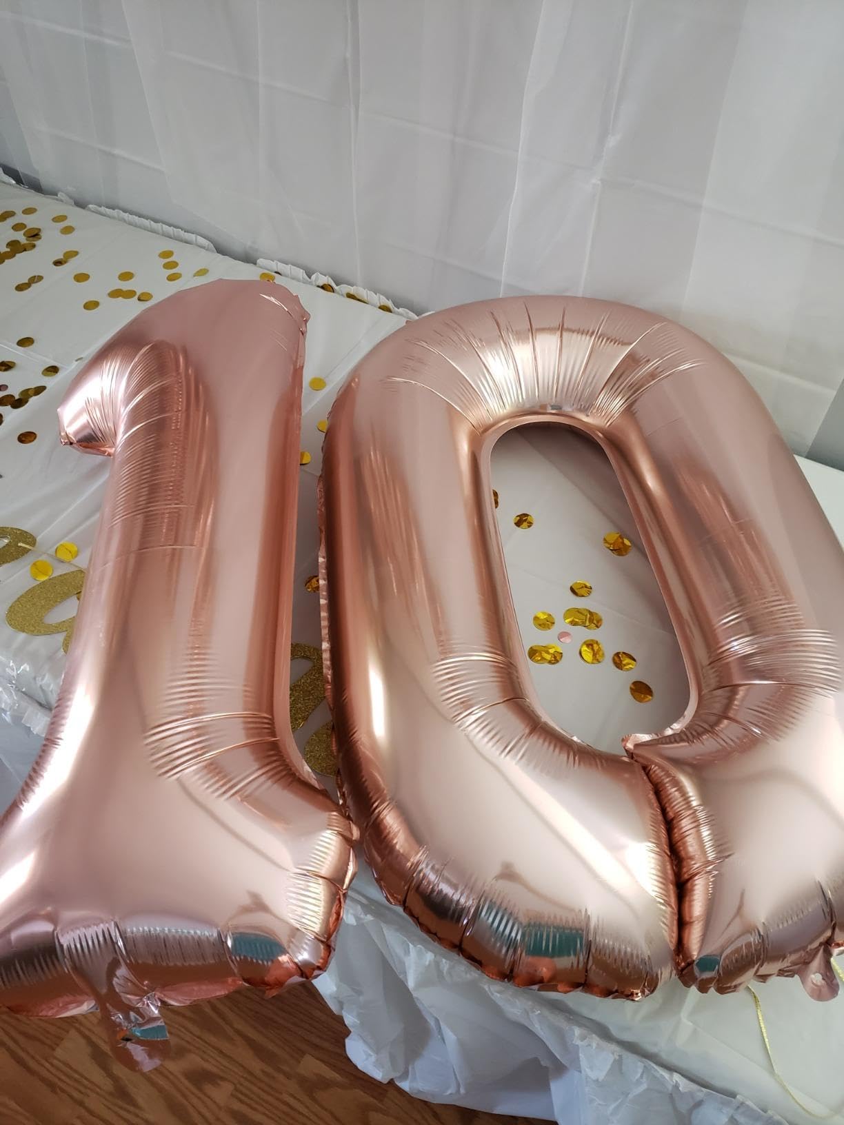 40 inch rose gold number balloon highlights milestones with a luxurious vibe.