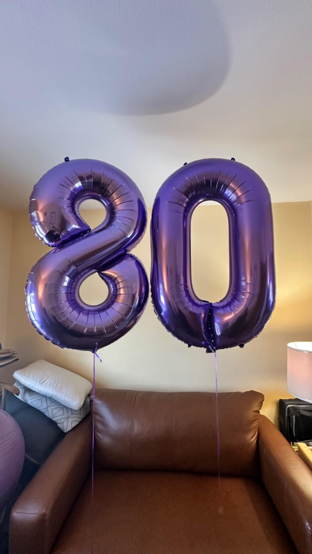 Enyeopd two-color number balloons decorate diverse birthday themes.