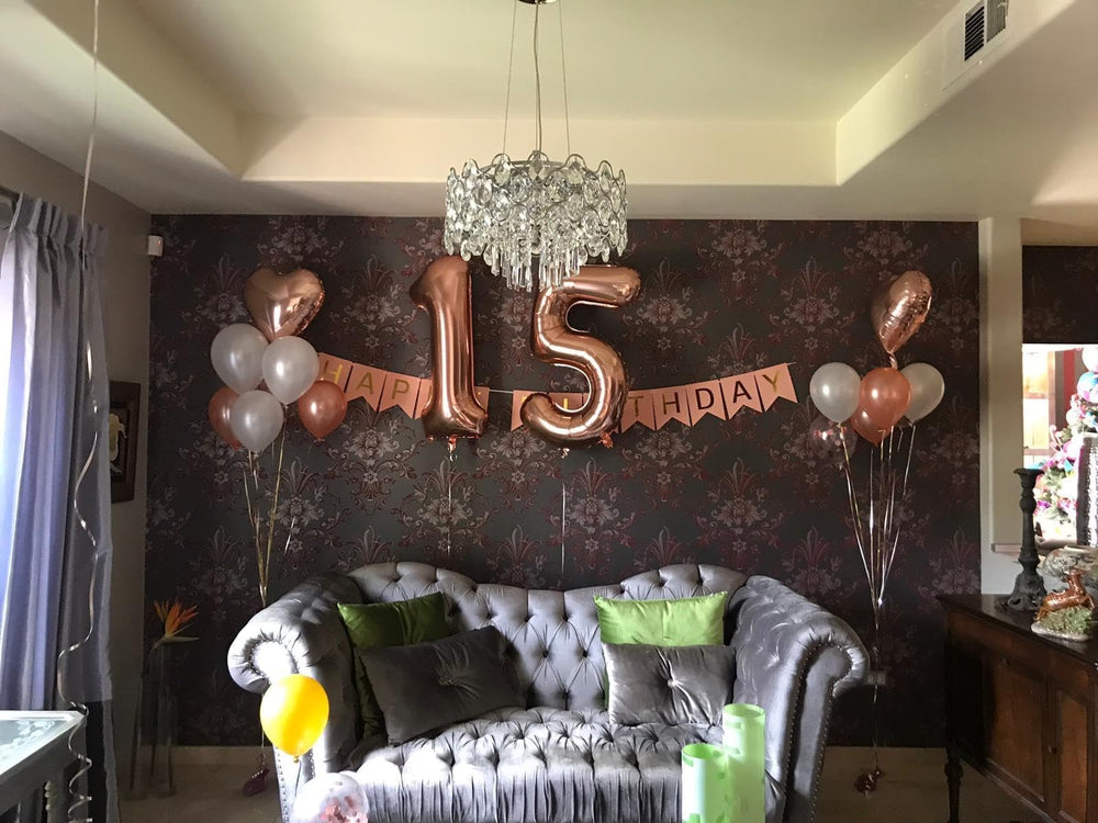 Enyeopd Wedding and anniversary décor rose-gold numbers create elegant backdrops.