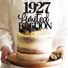 EONNCNT black-glitter cake topper with 1927 emblem enhances party decor.
