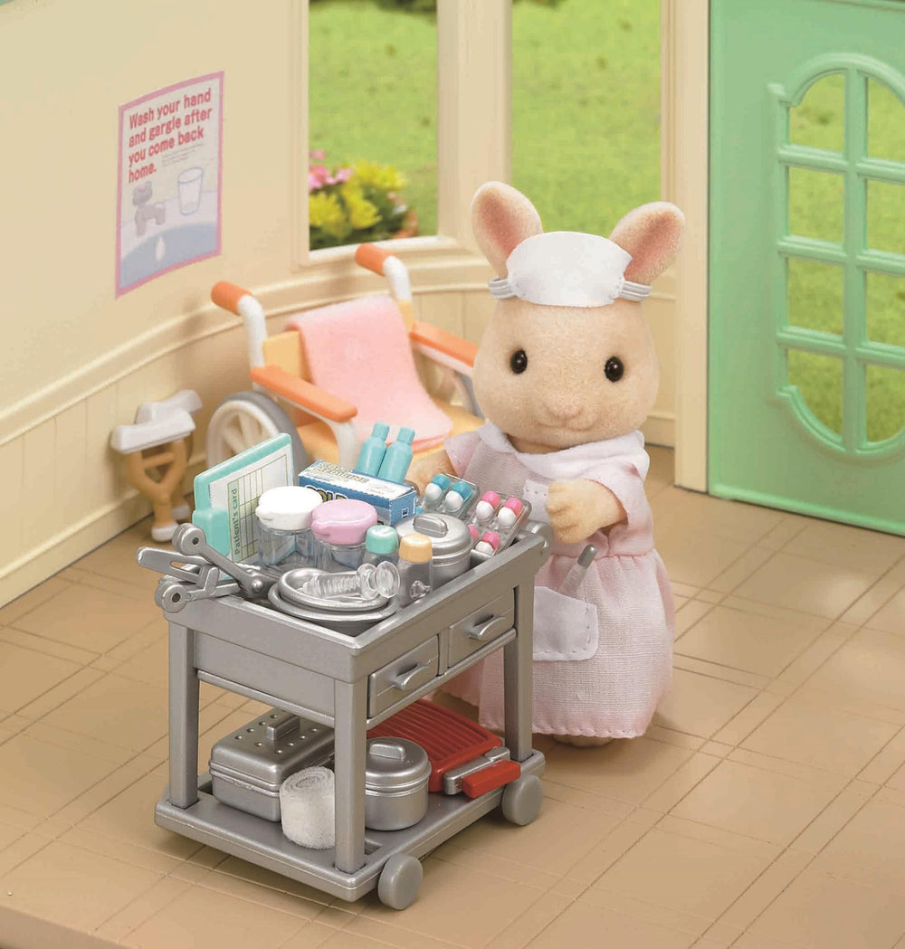Epoch Sylvanian nurse set in action within a pretend Sylvanian hospital scene.