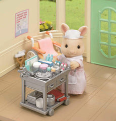Epoch Sylvanian nurse set in action within a pretend Sylvanian hospital scene.