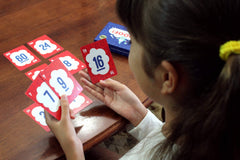 Evermade Proof! Math Game number cards spread for rapid mental math challenges.