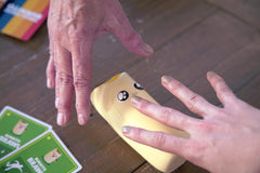 Exploding Kittens burrito replacement pieces on table boost game-night chaos and fun.
