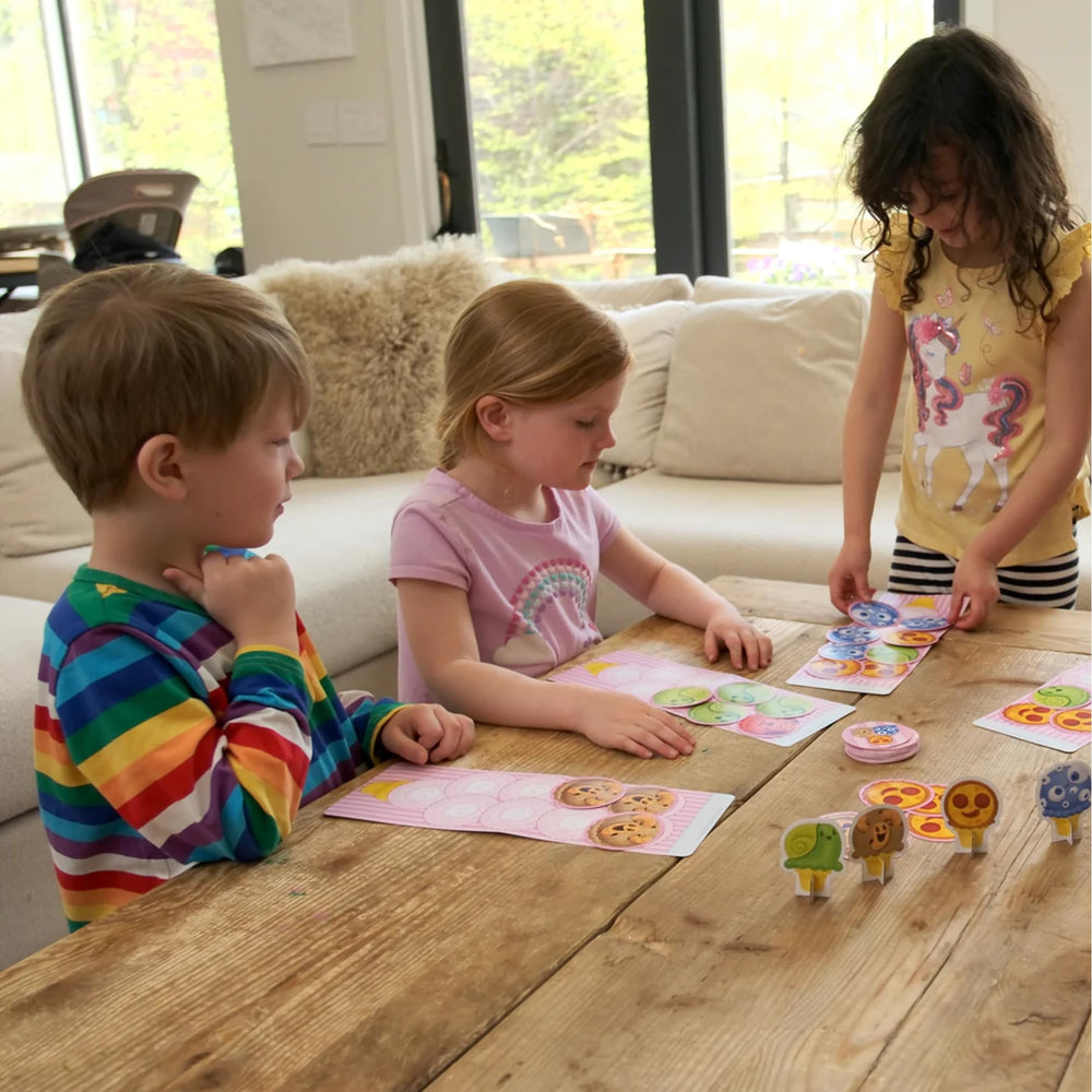 Exploding Kittens family game-night setup featuring cones and cards for easy rounds.