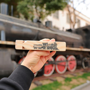 Fartime wooden train whistle package open, ready to gift
