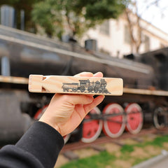 Fartime wooden train whistle package open, ready to gift