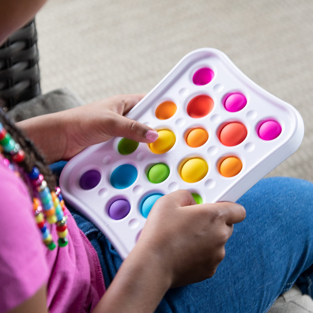 Fat Brain Dimpl Pops squishy silicone bubbles provide satisfying tactile feedback.