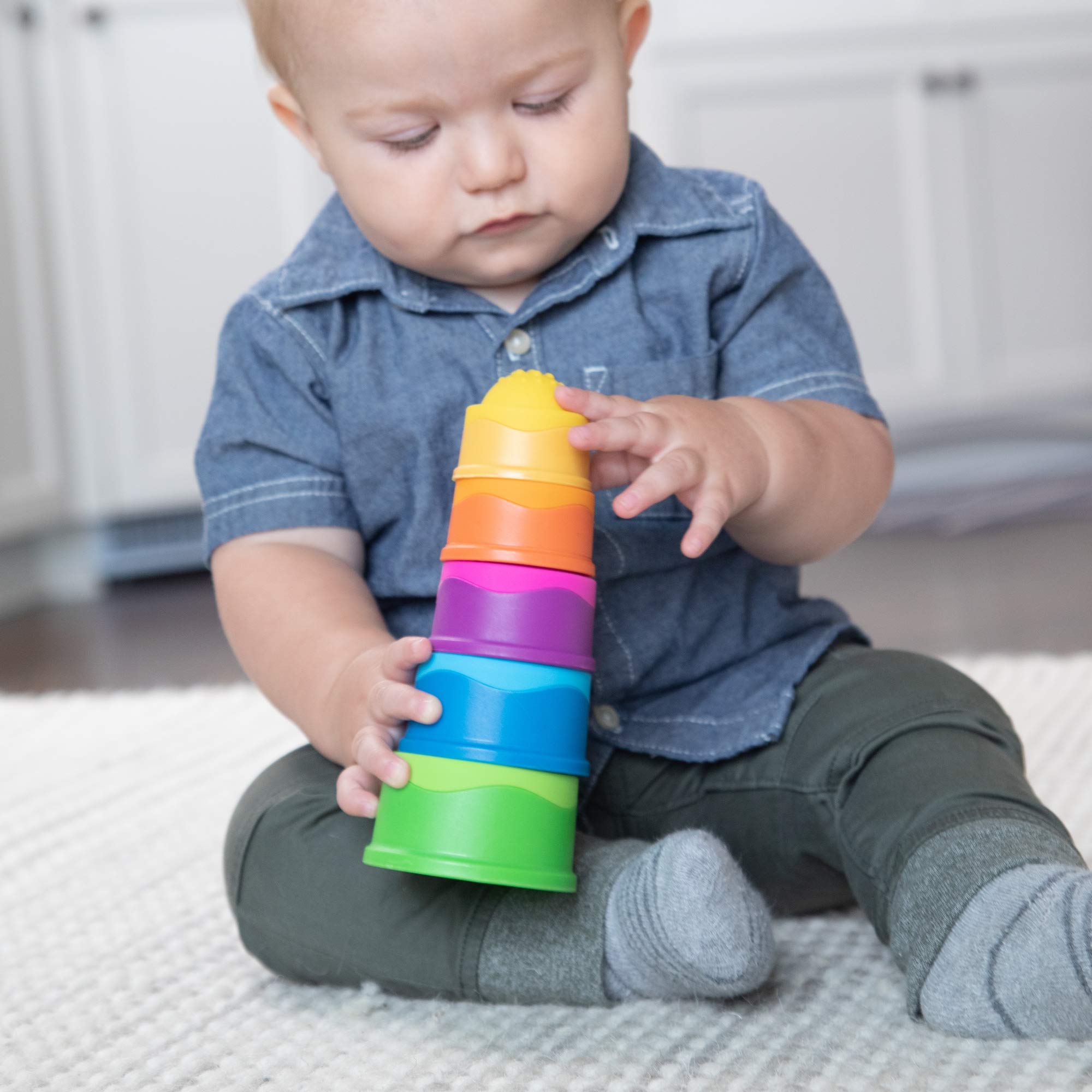 Fat Brain Toys Dimpl Stack nesting cups for order and spatial awareness during play.