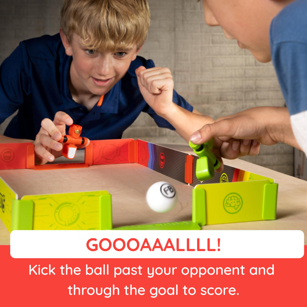 Foosbots in action with two players spinning and kicking the ball during a friendly match.