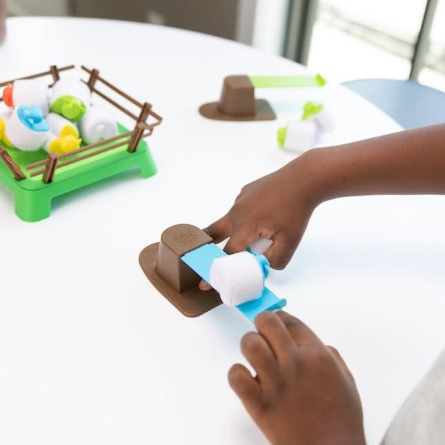 Heap-O-Sheep field with catapult action focuses on fine motor skills and concentration