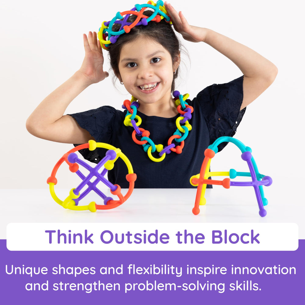Fat Brain Toys Plip Kit creative structure with modular silicone pieces in action.