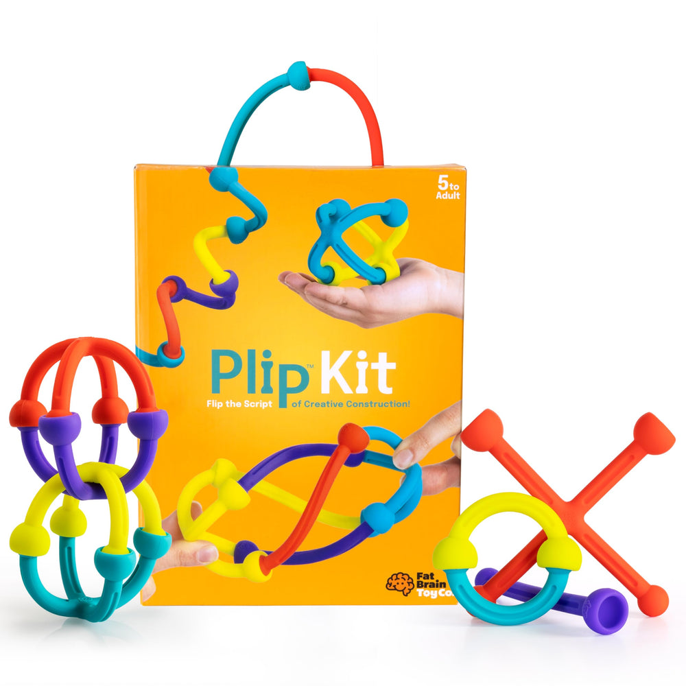 Fat Brain Toys Plip Kit pieces spread for creative building and open-ended play.