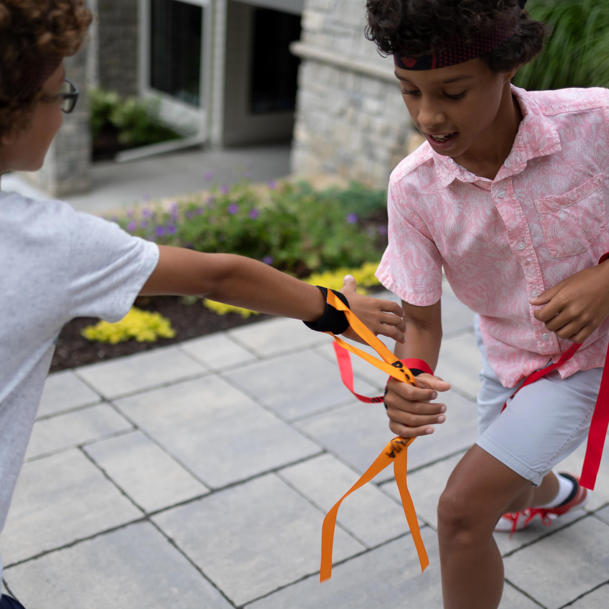 Ribbon Ninja Game set up for outdoor play by Fat Brain Toys