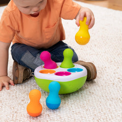 Fat Brain SpinnyPins slots support early sorting and problem solving.