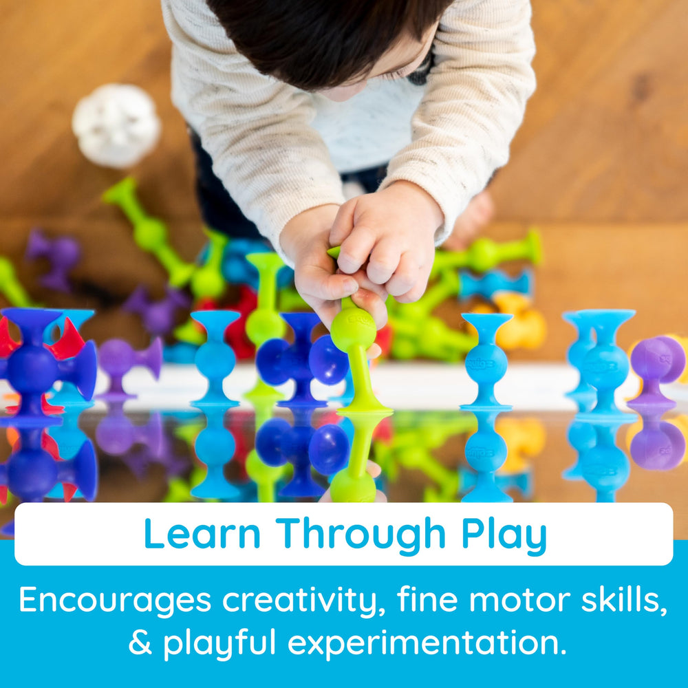 Fat Brain Toys Squigz hand-held sensory pieces for interactive play.