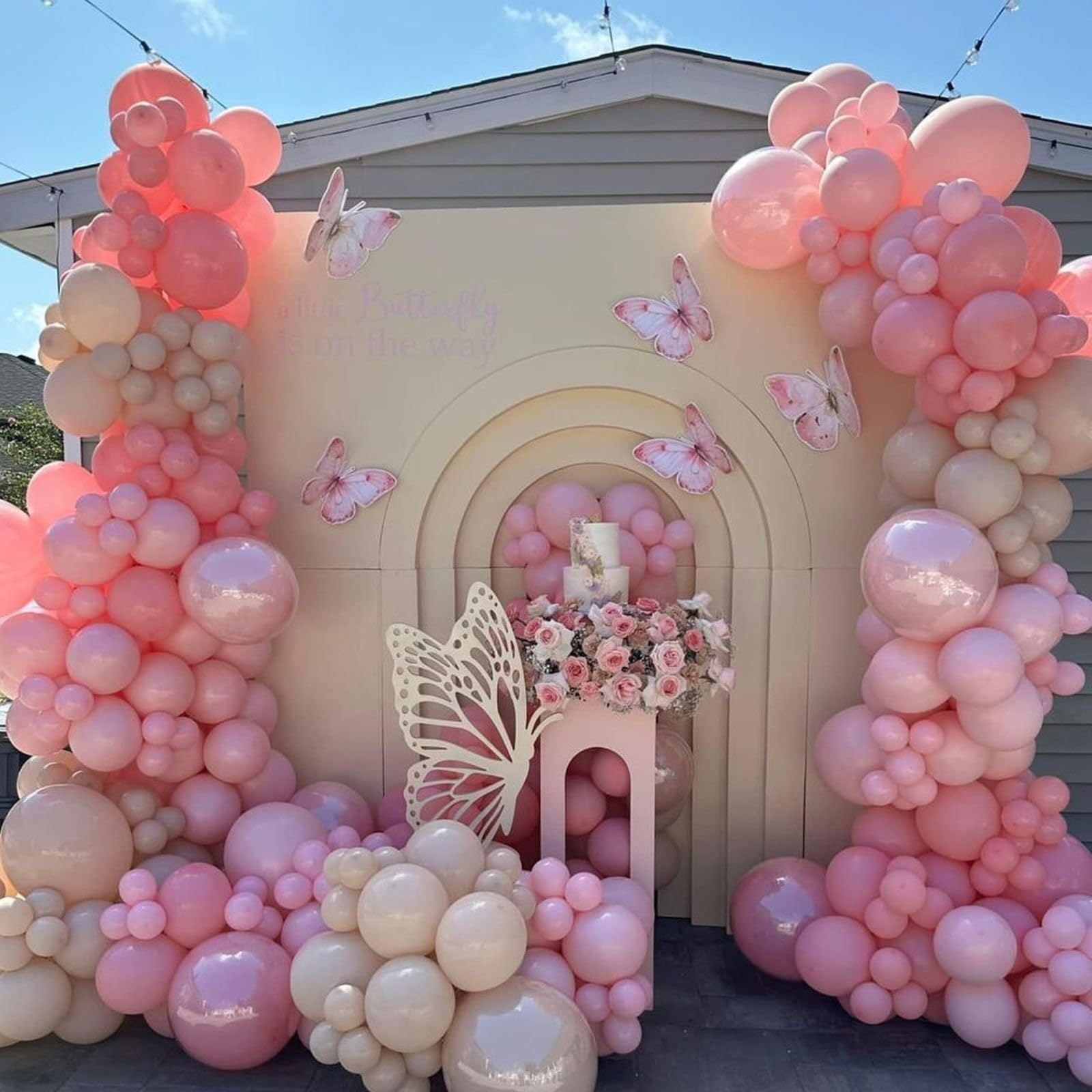 FEYG pearl pink balloons create a soft, sophisticated backdrop.
