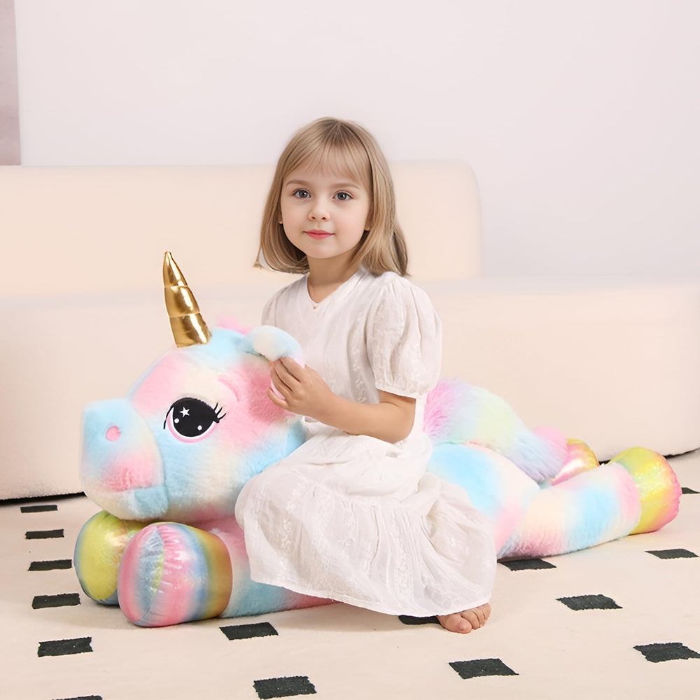 FFxiong 110cm unicorn pillow in a cozy bedroom setting