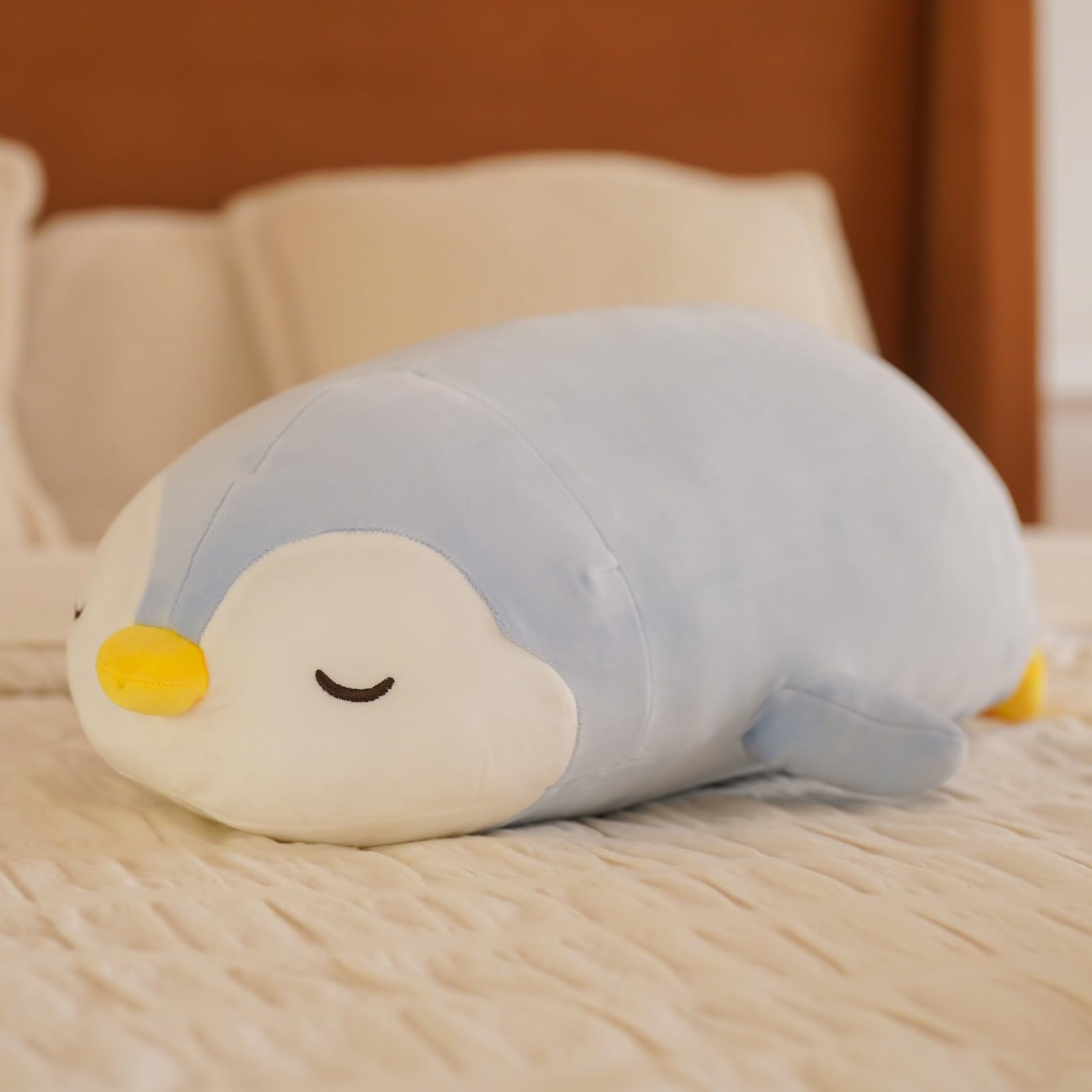 FFxiong penguin plush close-up highlights soft exterior and inviting eyes