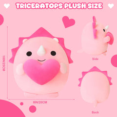 Close-up of the heart motif on the Finebee pink dinosaur plush.