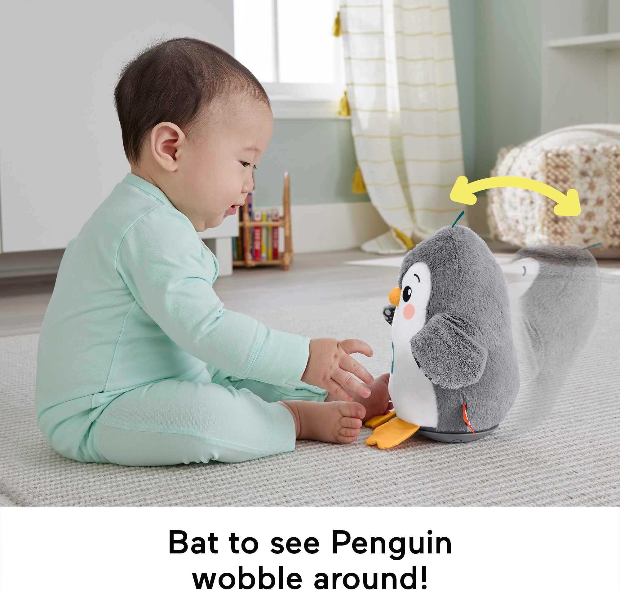 Roly-poly base of Fisher-Price penguin encouraging wobble play as baby grows.