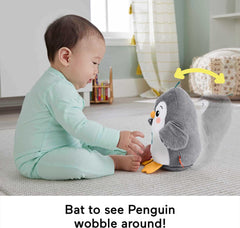 Roly-poly base of Fisher-Price penguin encouraging wobble play as baby grows.