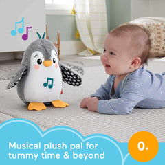 Penguin wing-flap action in Fisher-Price toy during tummy time play.