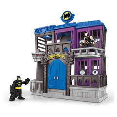 Fisher-Price Imaginext Batman figure ready for action in Gotham City Jail during pretend play.