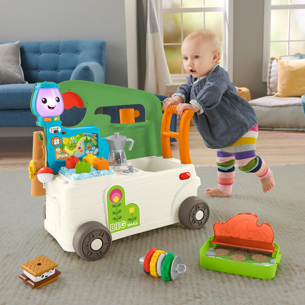 Fisher-Price Laugh and Learn camper walker side view with busy play pieces supporting fine motor play