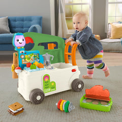 Fisher-Price Laugh and Learn camper walker side view with busy play pieces supporting fine motor play