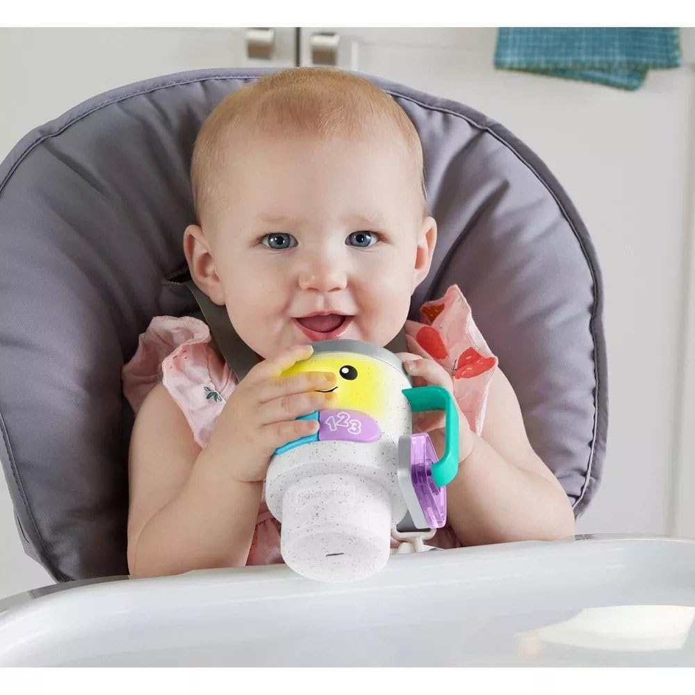 Fisher-Price Laugh & Learn mug buttons trigger lights and songs for colors.
