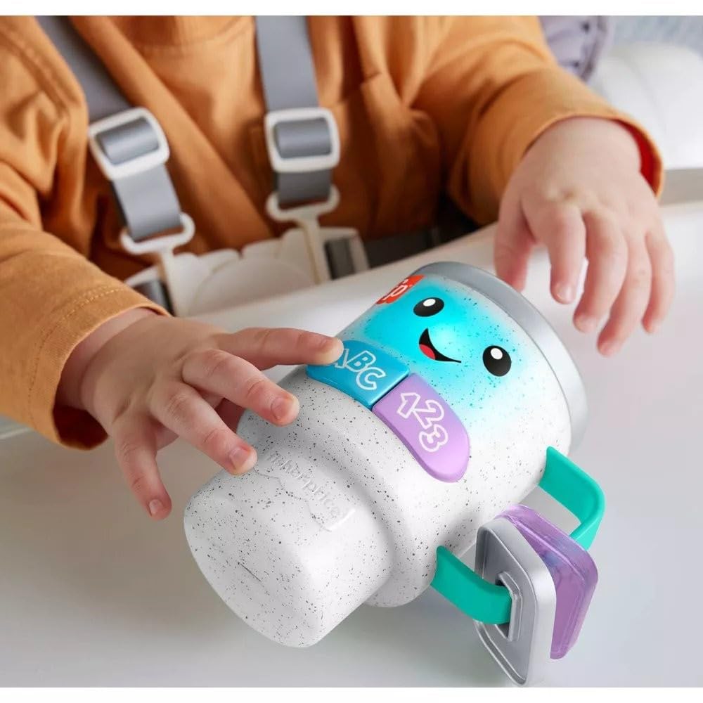Fisher-Price Laugh & Learn mug lid reveal shows beads for tactile play.