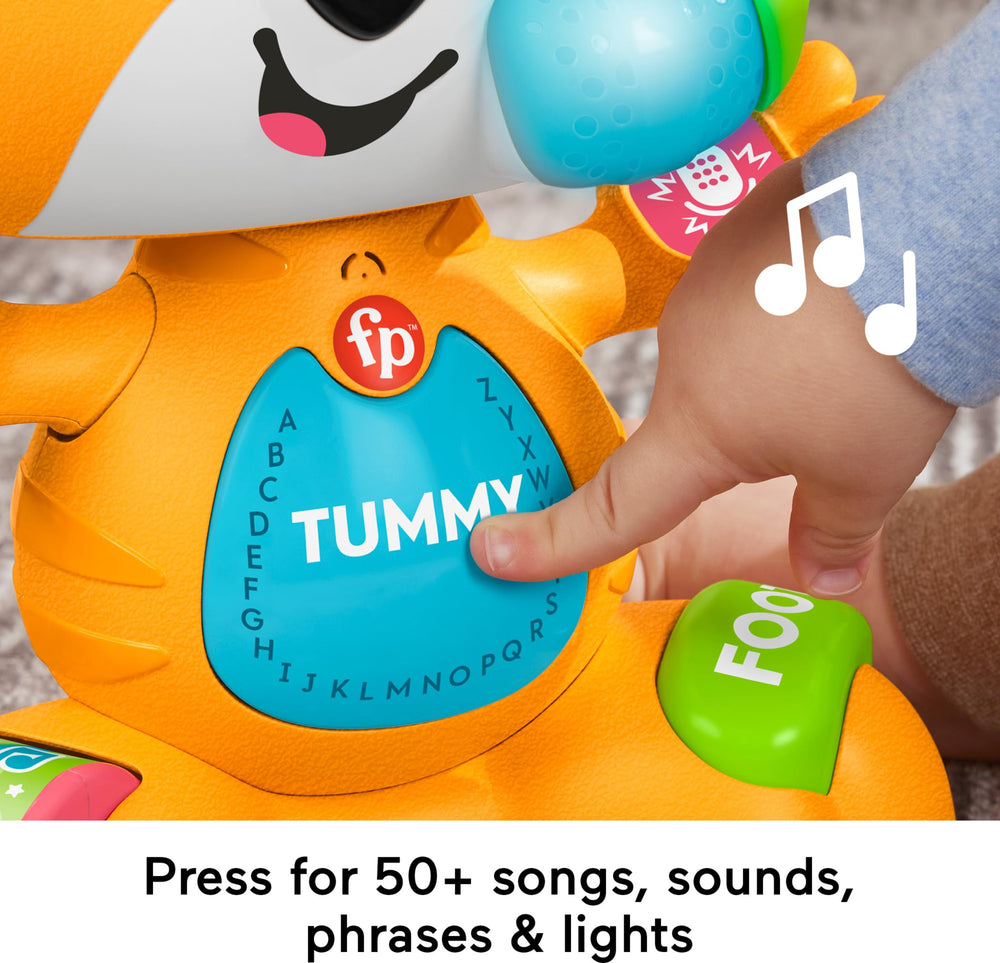 Fisher-Price Link Squad Tiger press-button and roller-spin triggers music and lights.