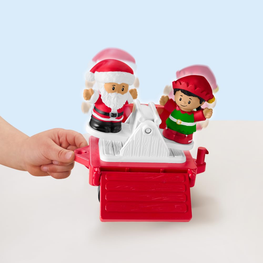 Fisher-Price Santa figure enhances holiday-themed role-play during train adventures.