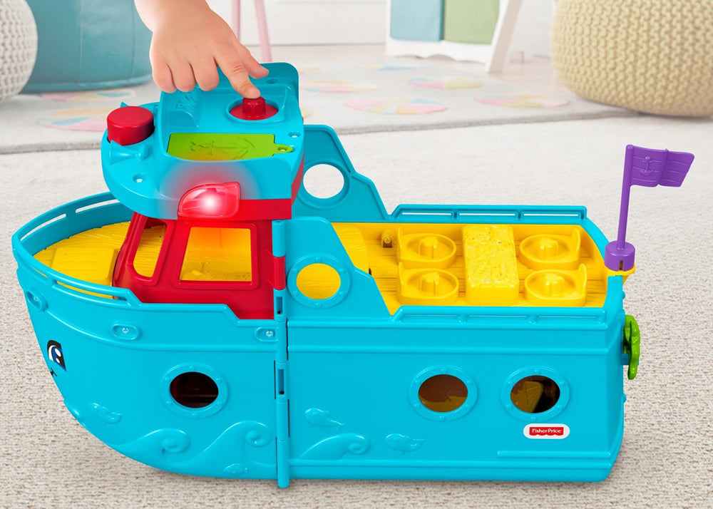 Fisher-Price Little People Travel Together Friend Ship opened to reveal beach area for imaginative storytelling