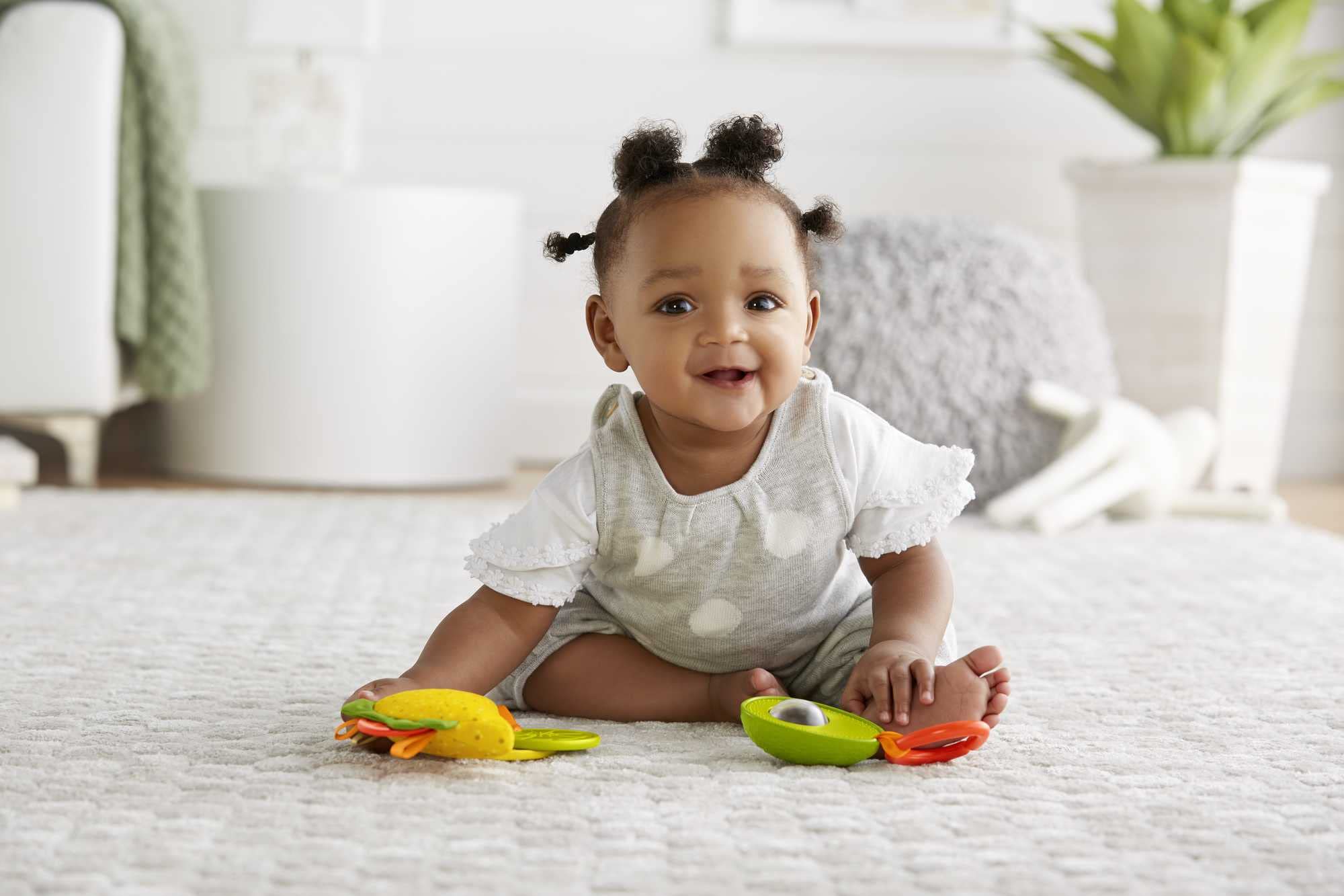 Fisher-Price lettuce and tomato teethers for curious babies' grasping and exploration
