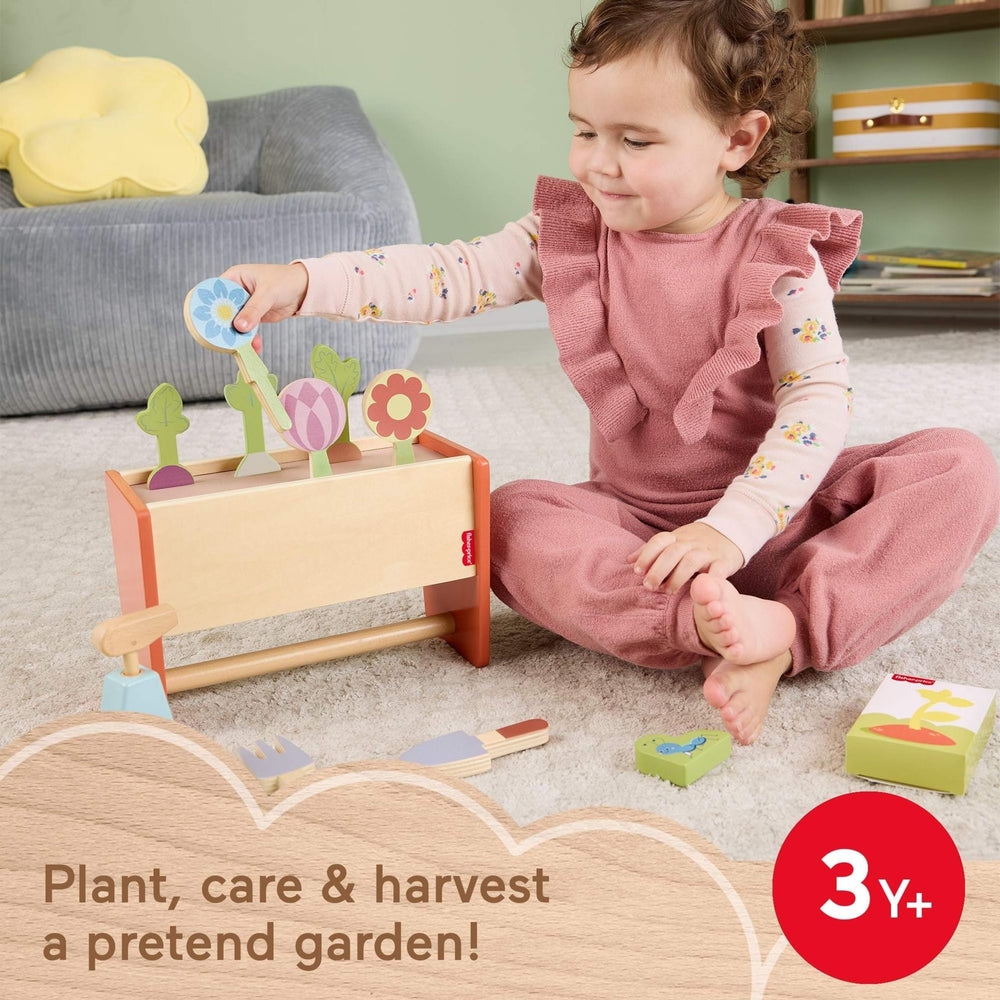Fisher-Price wood garden tools pair enables hands-on care and role-play.