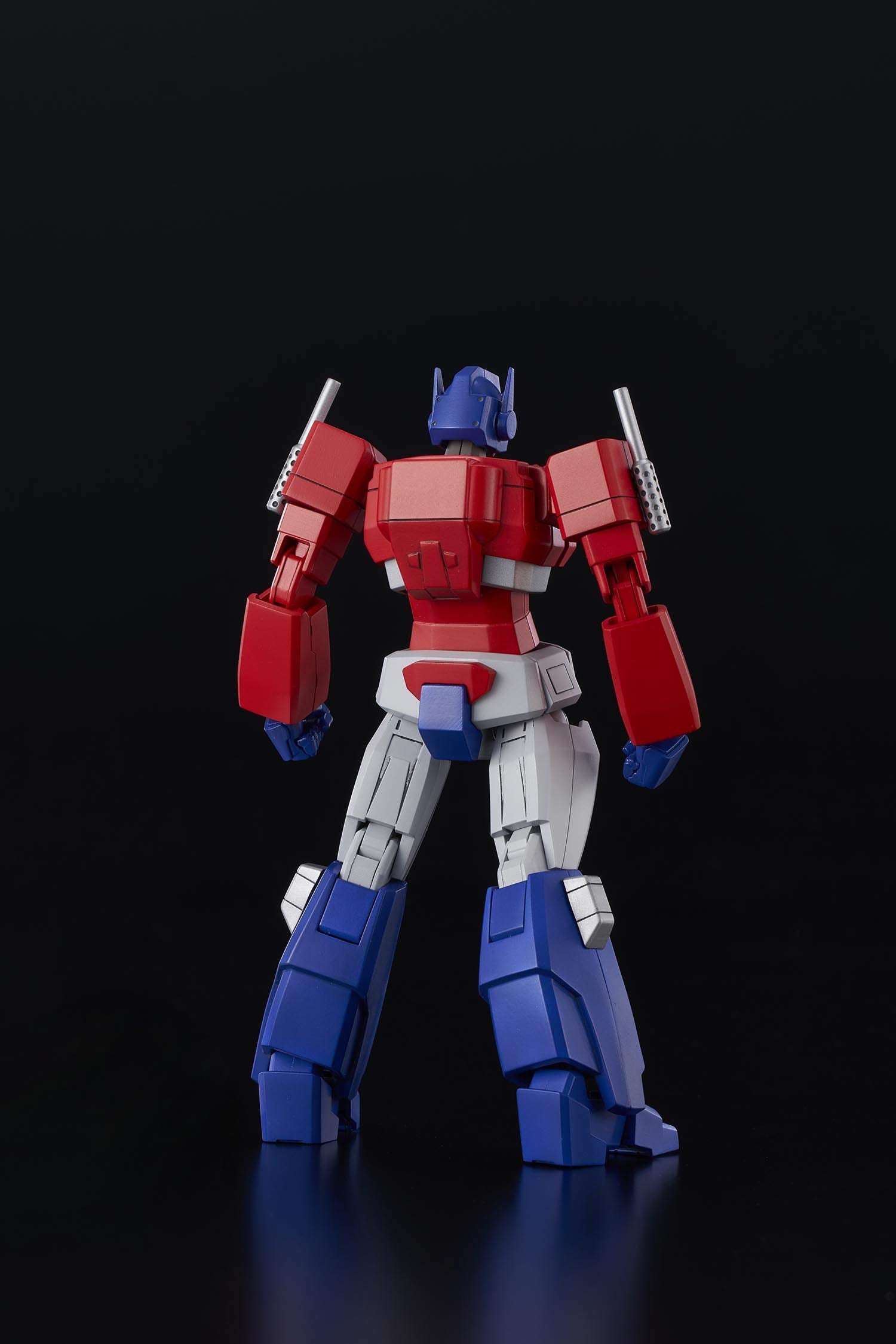 Flame Toys Optimus Prime blaster accessory for action-ready display.