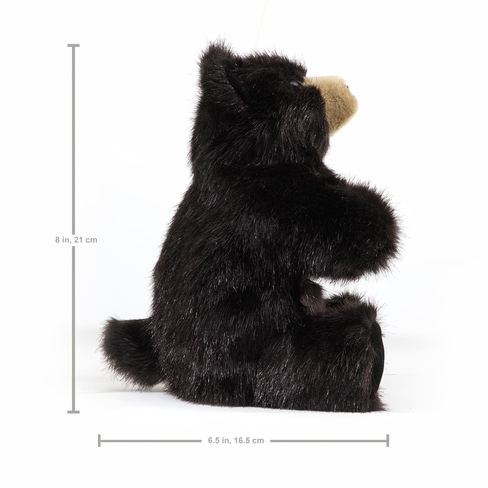 Folkmanis Baby Black Bear puppet on stage-ready setup invites pretend play.