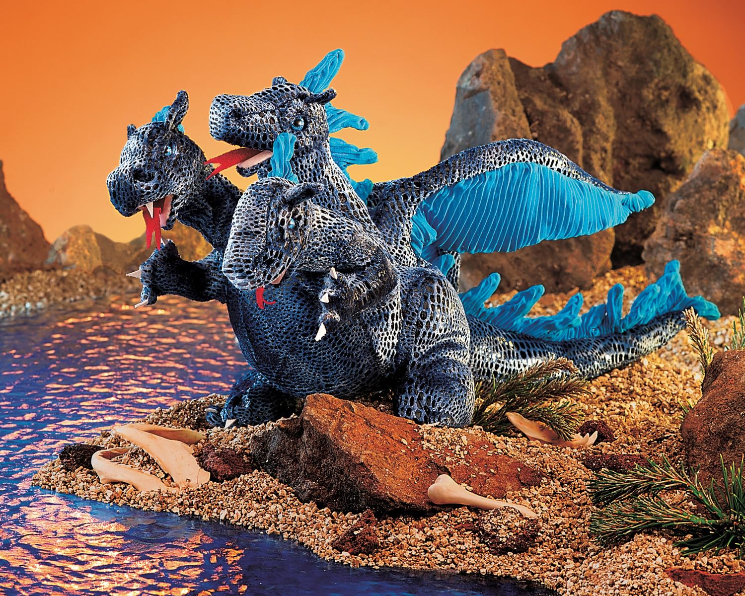 Folkmanis blue dragon hand puppet, durable and easy to care for.