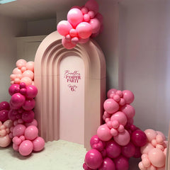FQZYLCH wedding decoration idea: pink arch as backdrop for ceremonies and photos.