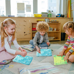 Frienda two-pack stress relief mats for calm on the go.