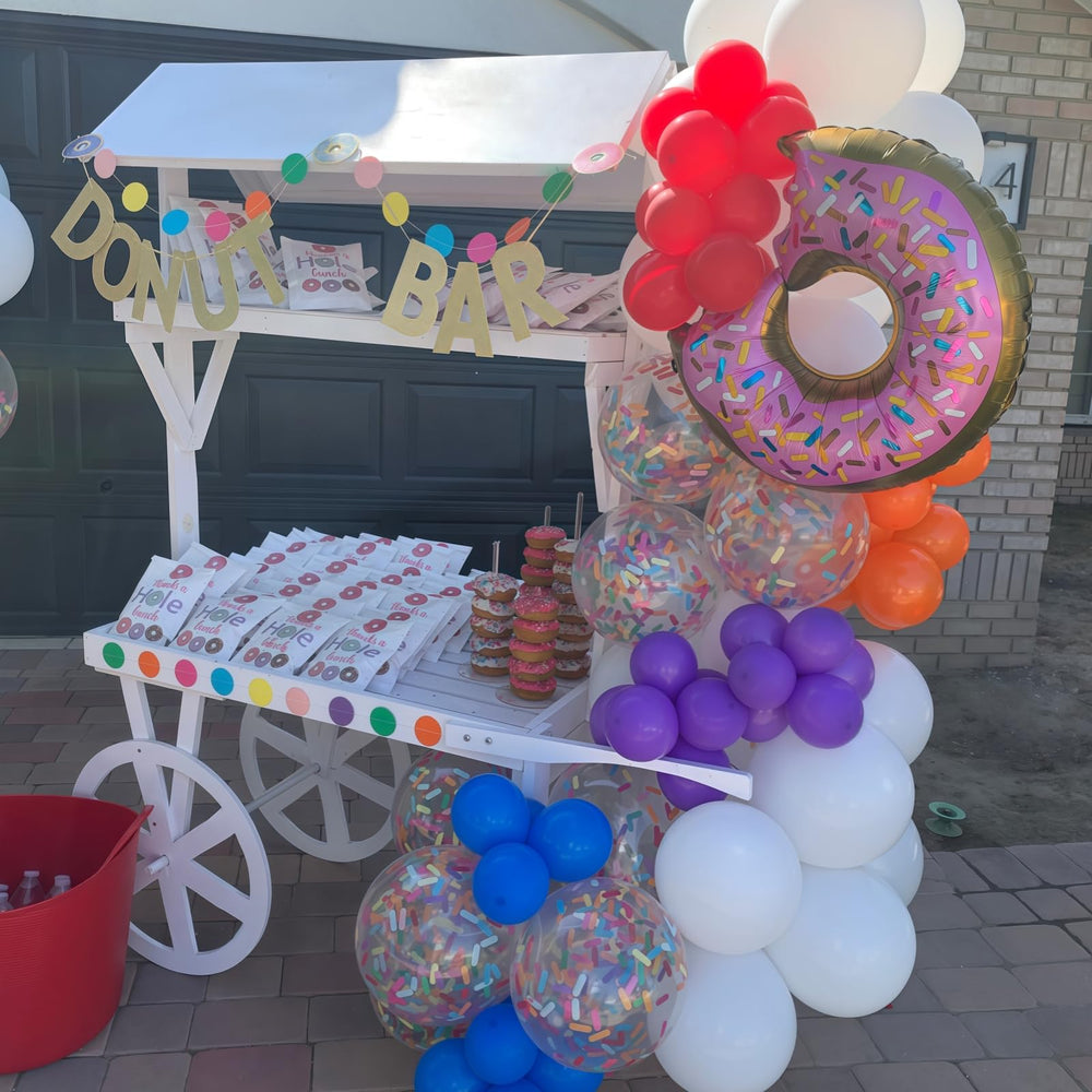 Froova ice-cream themed backdrop with clear confetti balloons enhances summer parties.