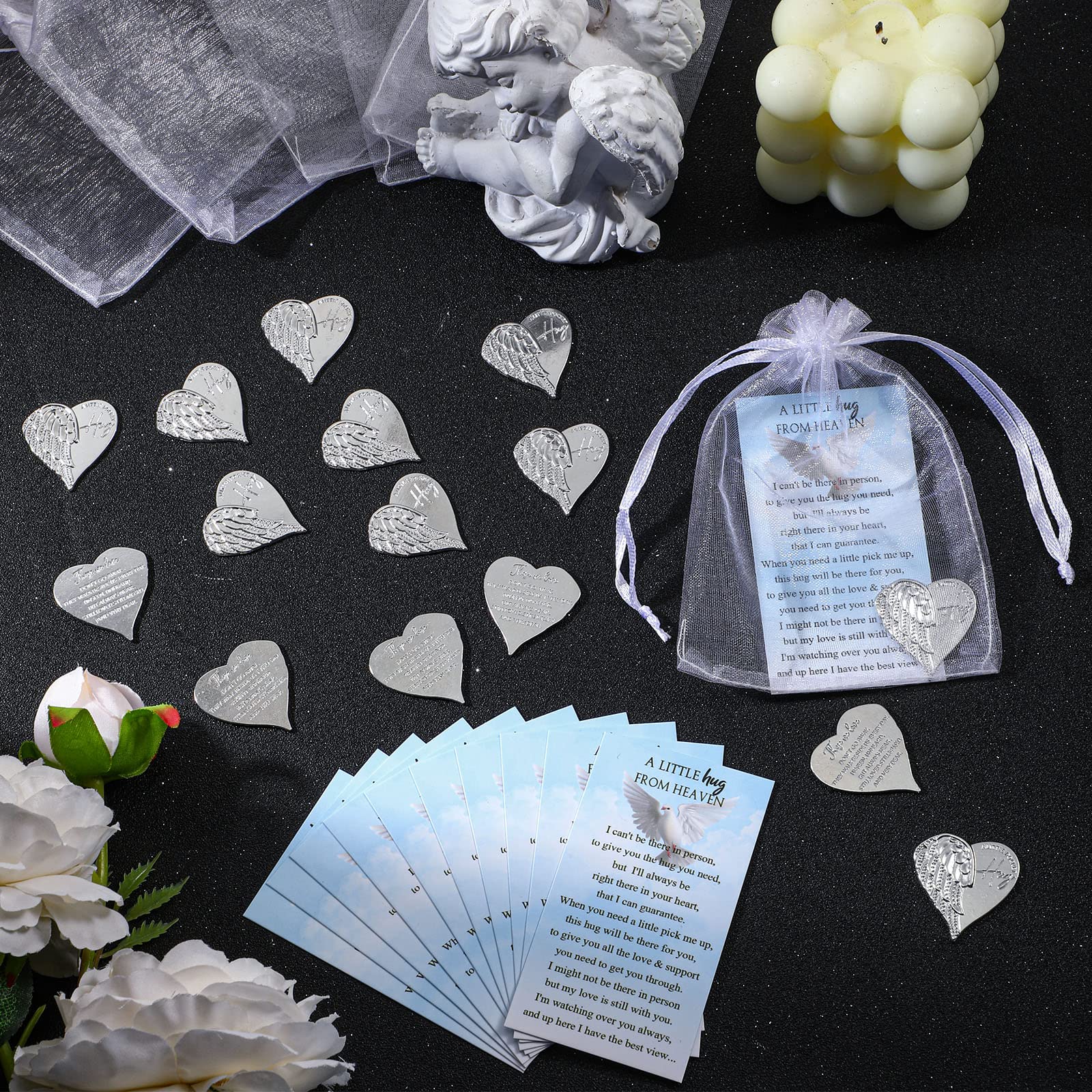 Fumete heart-shaped memorial coin, featuring angel feather design.