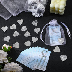 Fumete heart-shaped memorial coin, featuring angel feather design.