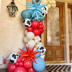 FunHot cow print balloons enhance rustic farm or western ambiance.