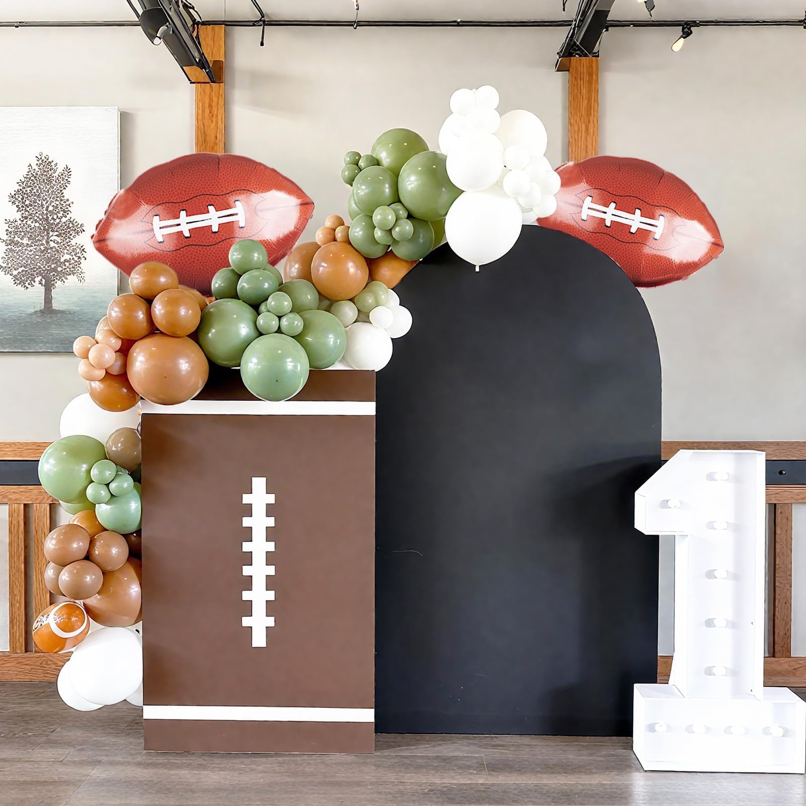 FunHot brown football print balloons emphasize the game theme at celebrations.