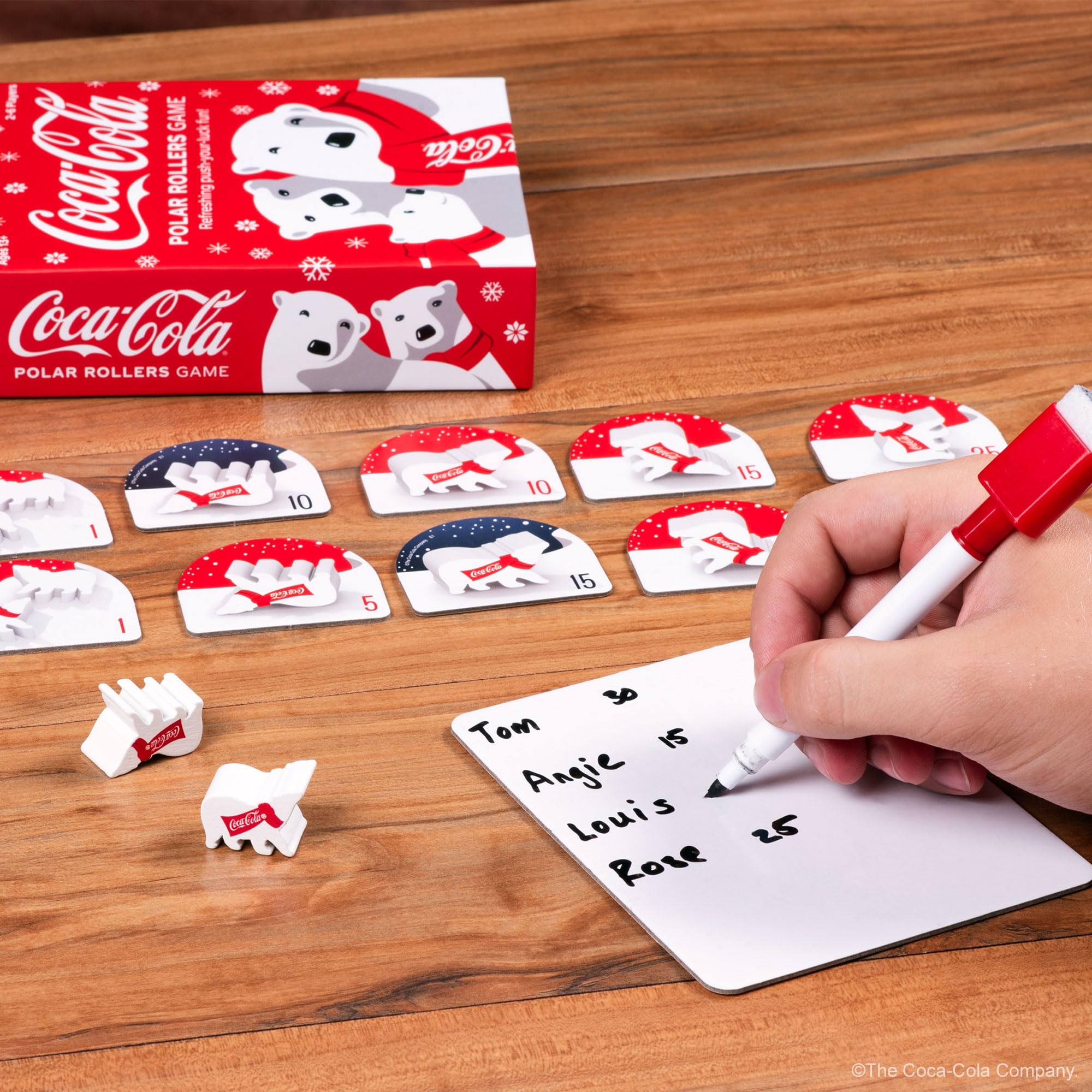 Funko Coca-Cola Polar Rollers players around the table for group fun.